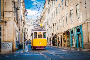 Yellow tram 28 on streets of Lisbon
